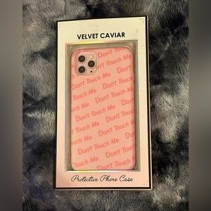Velvet Caviar’s Pink Do Not Touch Me Phone Case.